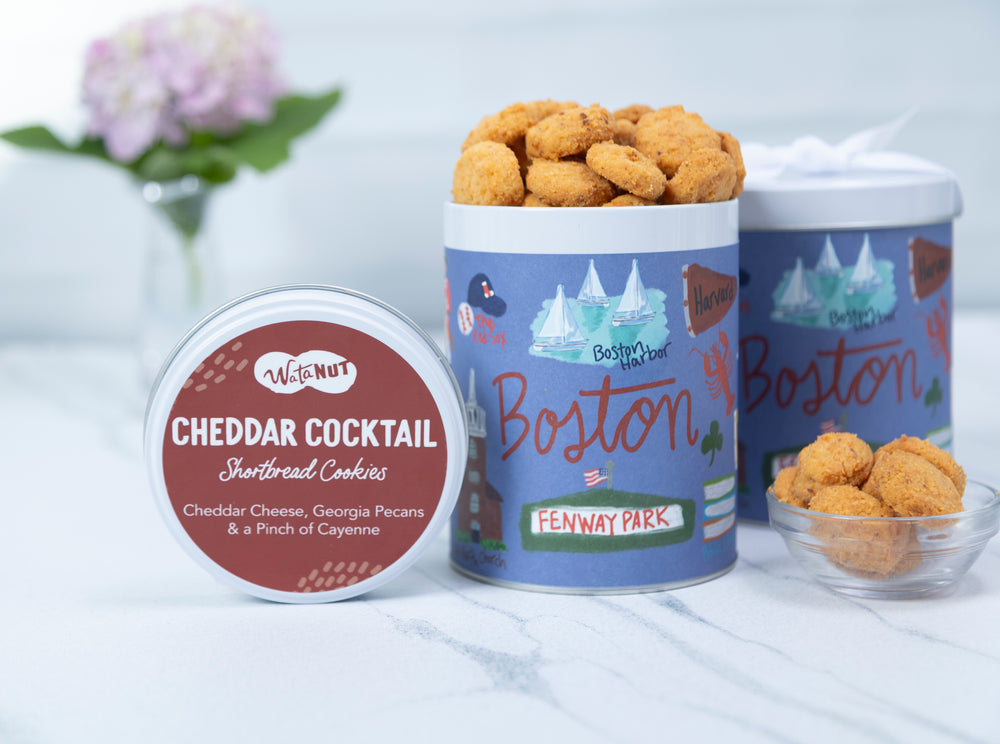 Cookies in branded containers with 'Boston' and 'Fenway Park' on a light background