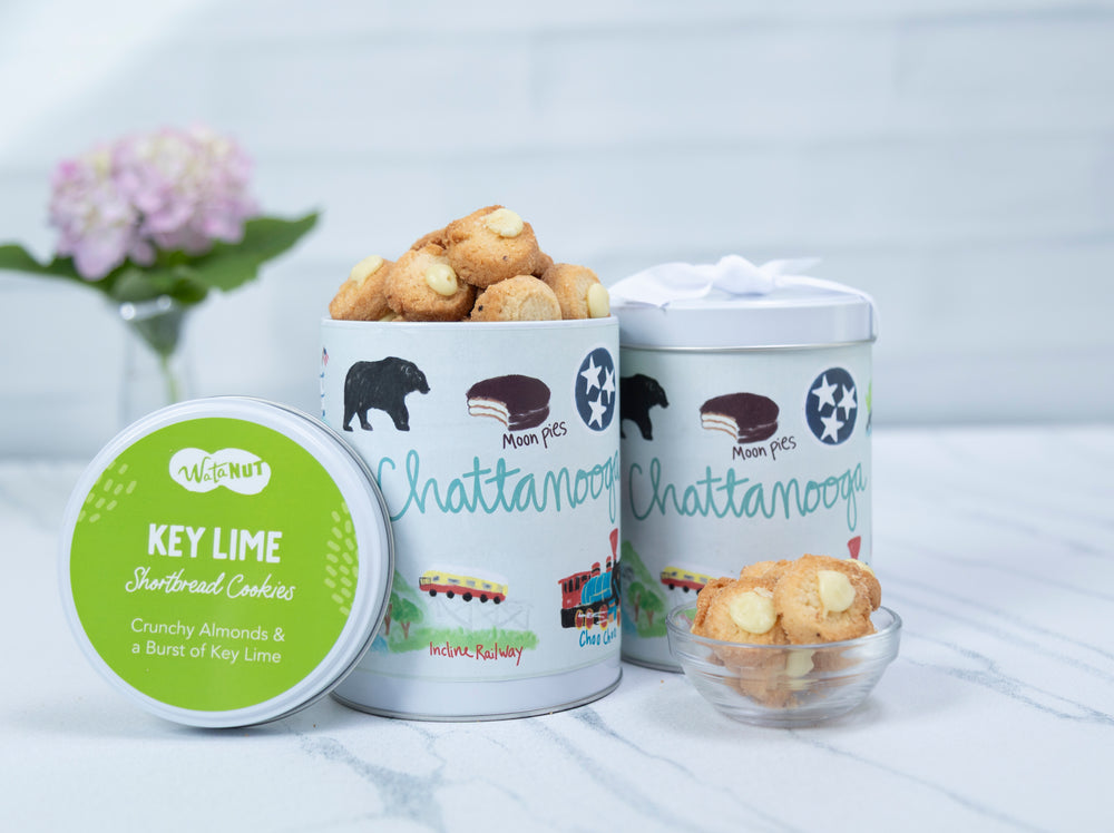 Three containers of cookies with visible branding on a light background